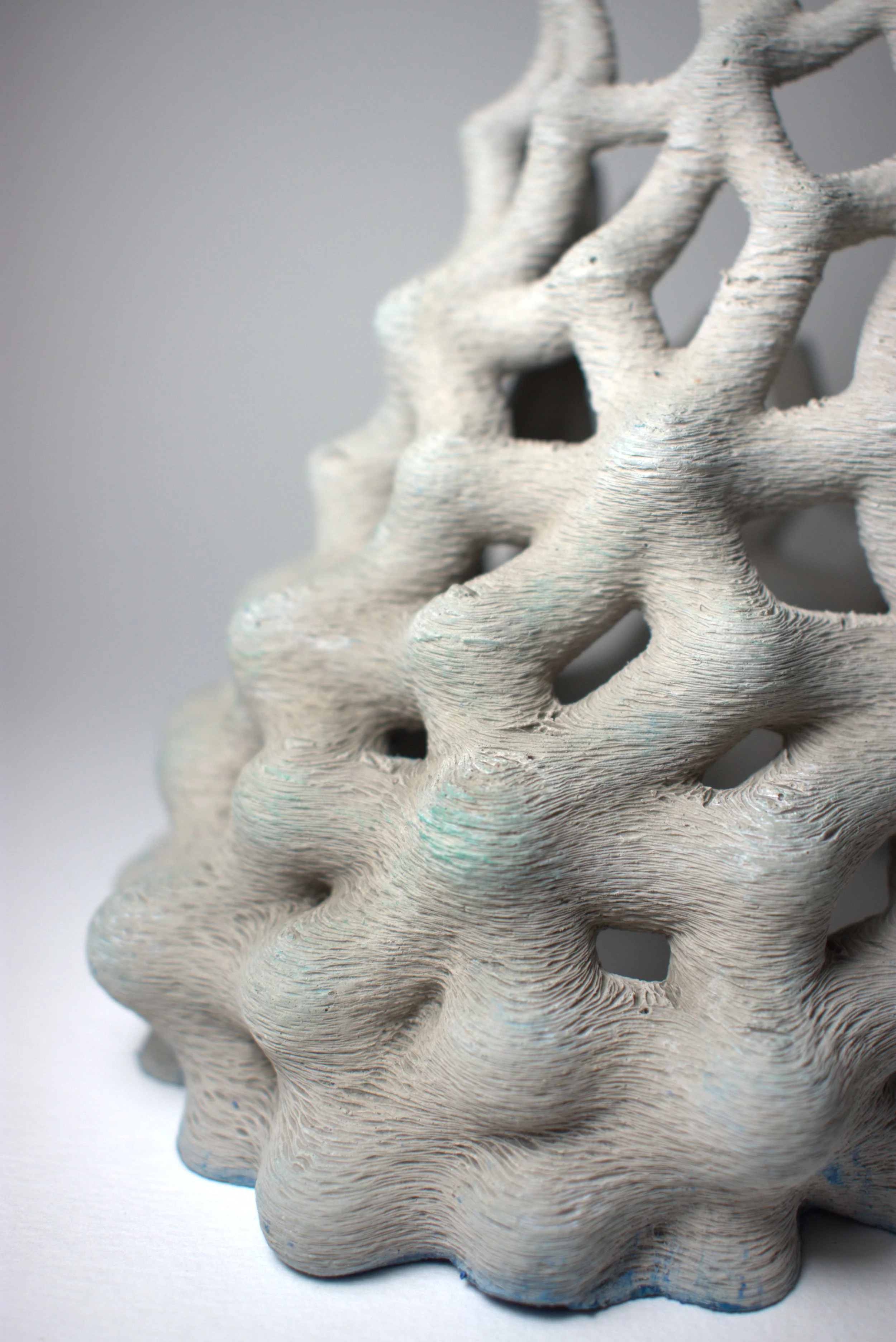 EnchantedMatter_FragmentsOfAFutureMythology1CloseUp_2025_ConcreteAndEnamel_12x12x12cm.jpg