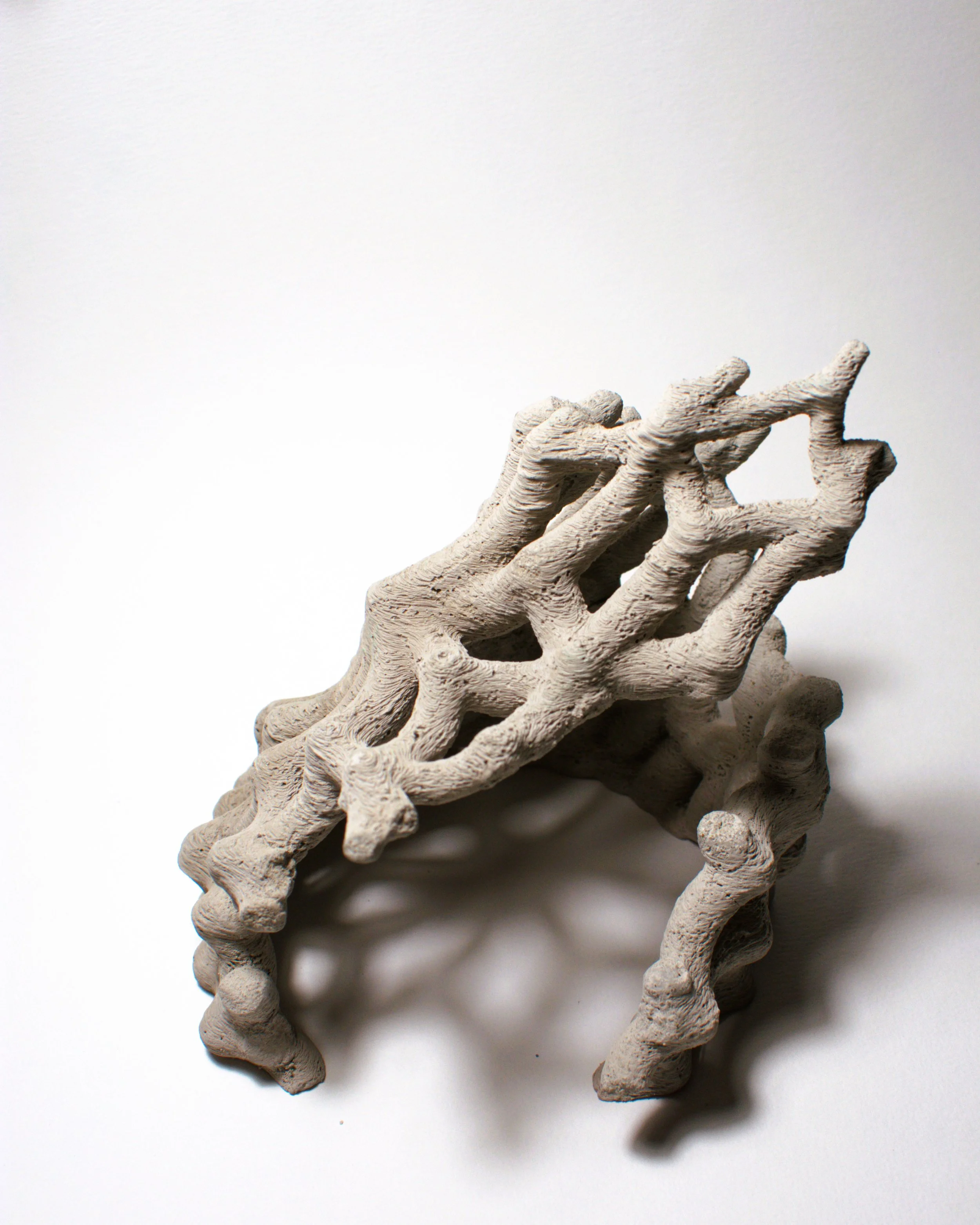 EnchantedMatter_FragmentsOfAFutureMythology2_2025_ConcreteAndEnamel_12x12x14cm.jpg