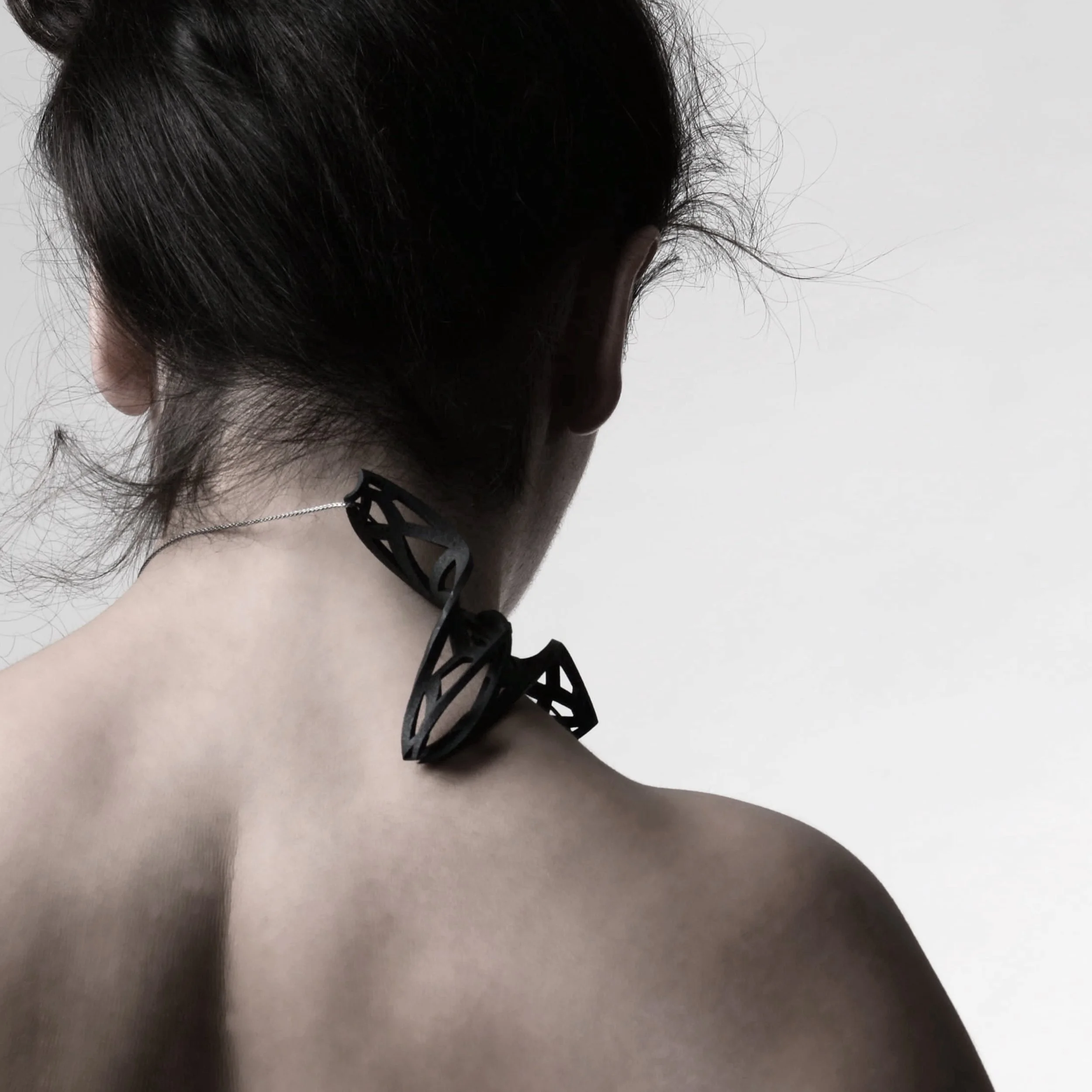 HalaGhatasheh_NeckPiece_2025_BlackSteel_10.9x7.2x2cm_NFS.jpg