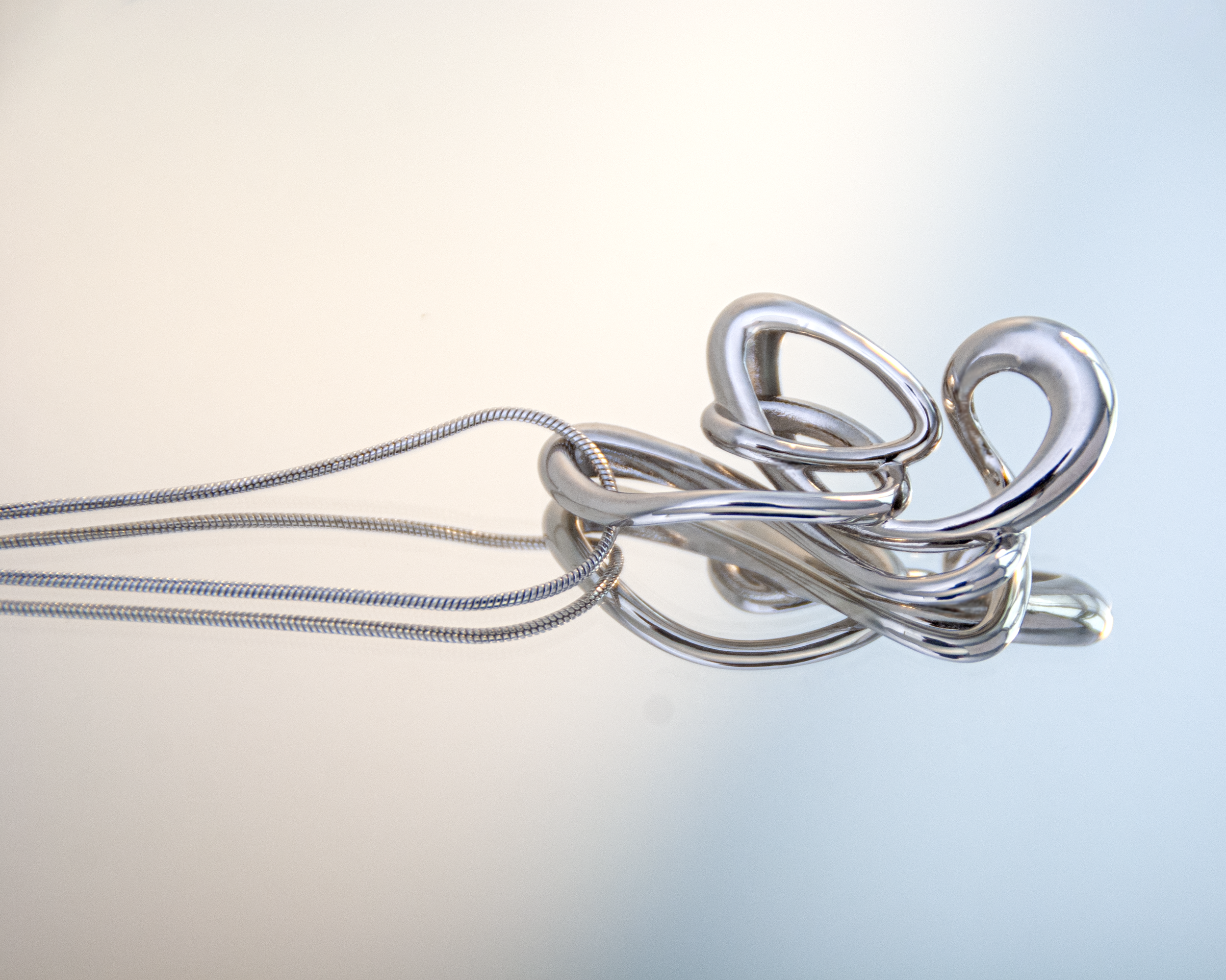 nood_FlickerNecklace_2025_RhodiumPlatedBrass_60cm_£52.png