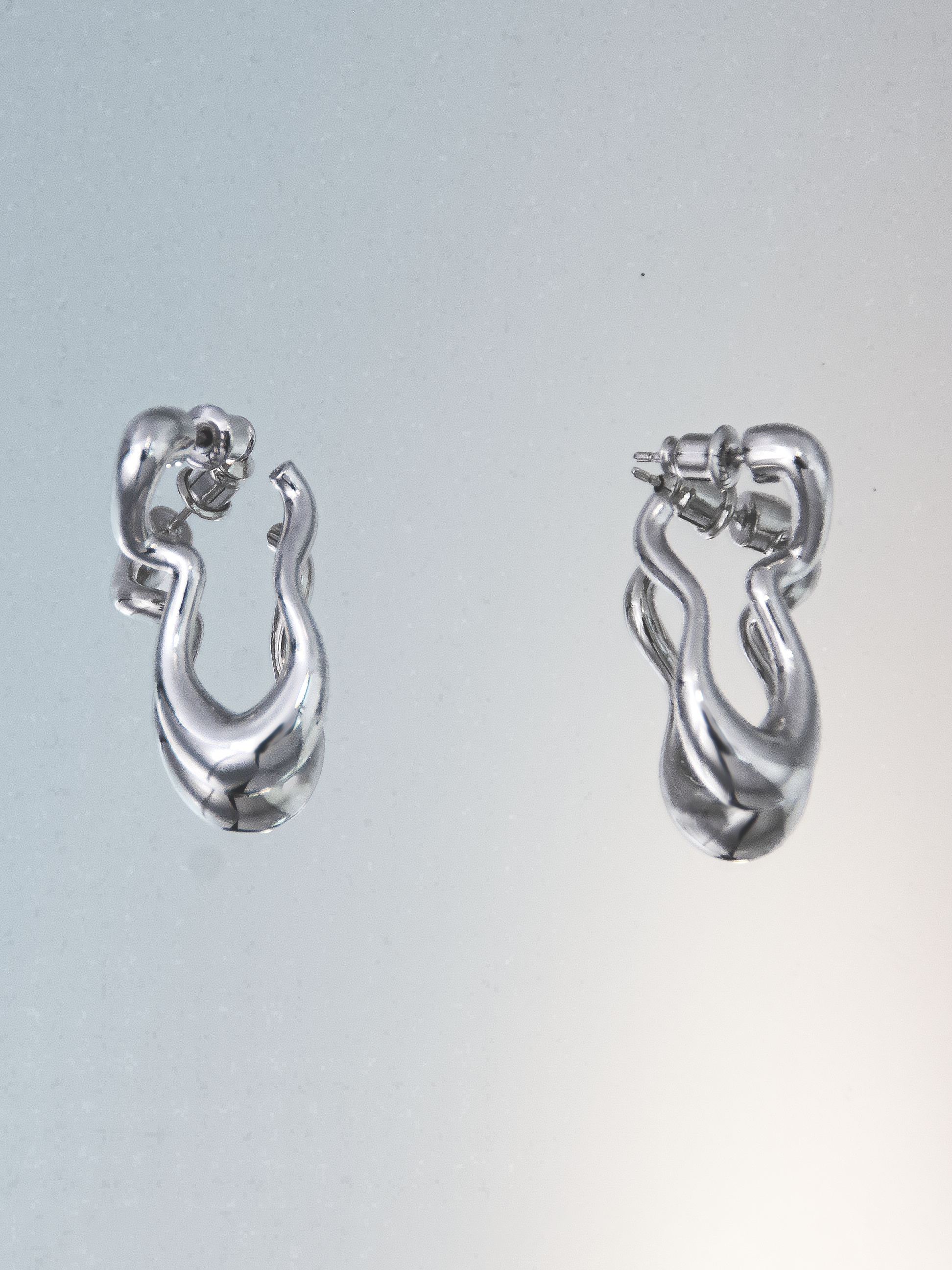 nood_TwirlingrEarrings_2025_RhodiumPlatedBrass_2x3cm_£46.png