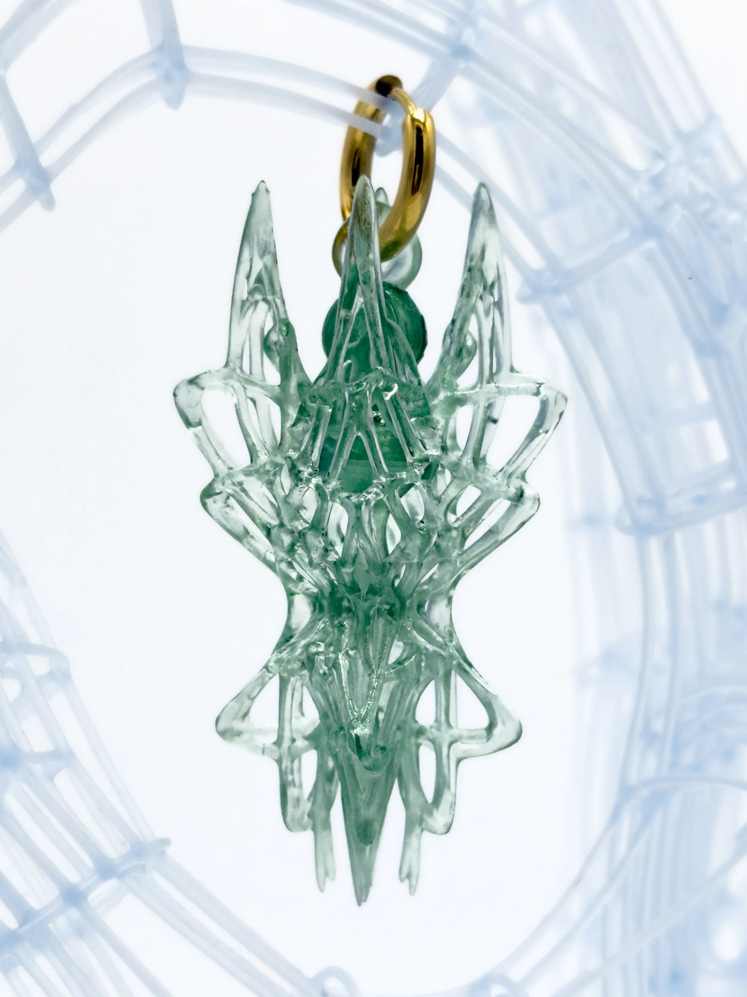 FernandaPovoa_AsterFractalisAcutus_green1_2024_ PlantBasedResinLacquer18kGoldPlated304StainlessSteelHoops_8x2x2cm_£130.jpg