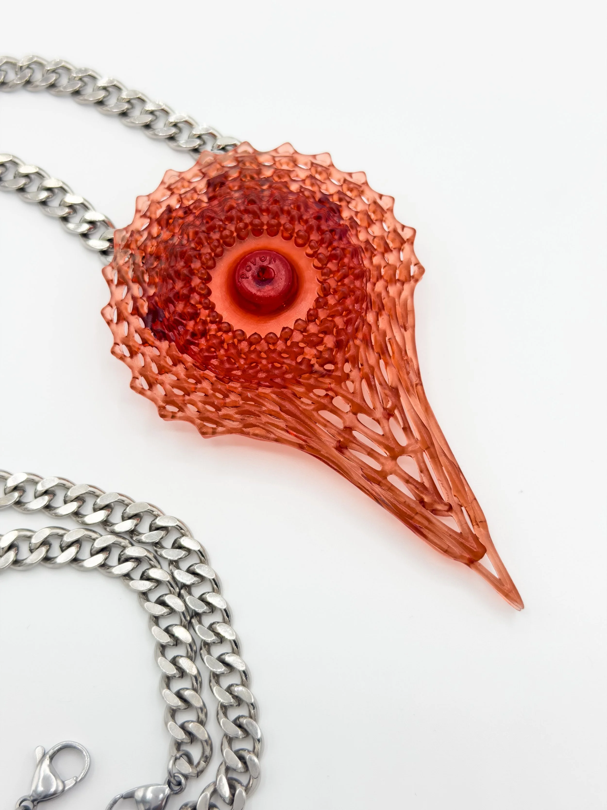 FernandaPovoa_OculusAreolae_red_2024_Plant-BasedResinLacquerSteelChain_11x7x2cm_£200.jpg