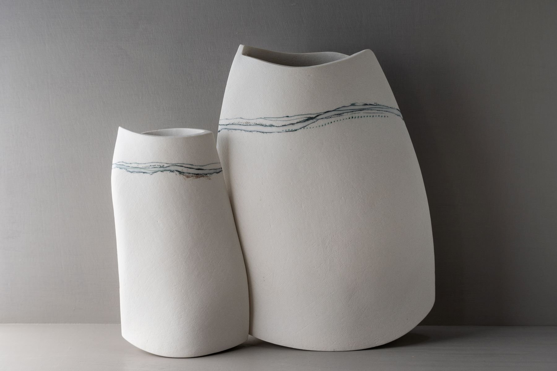 Stephanie Johnson_2Landmarks,vessels_2025_Ceramic,Porcelain_a)23x17x5b)17x10x4_a)500b)350.jpg