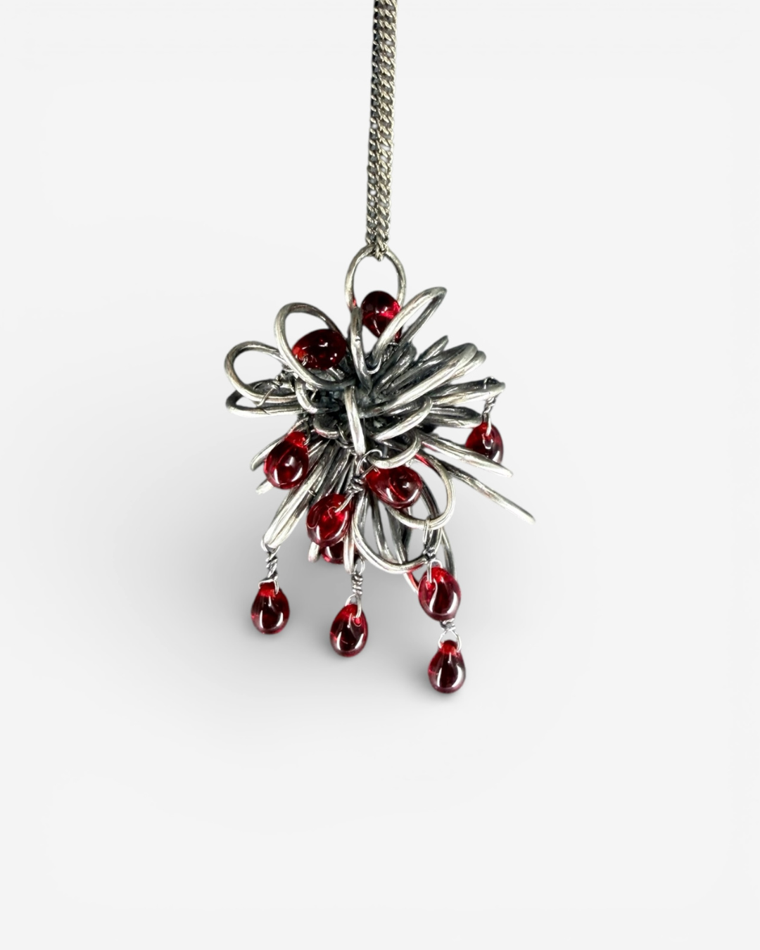 Ninimosi_InversionNecklace_2026_SterlingSilverAndCzechGlass_5x4x3cm_£360.png
