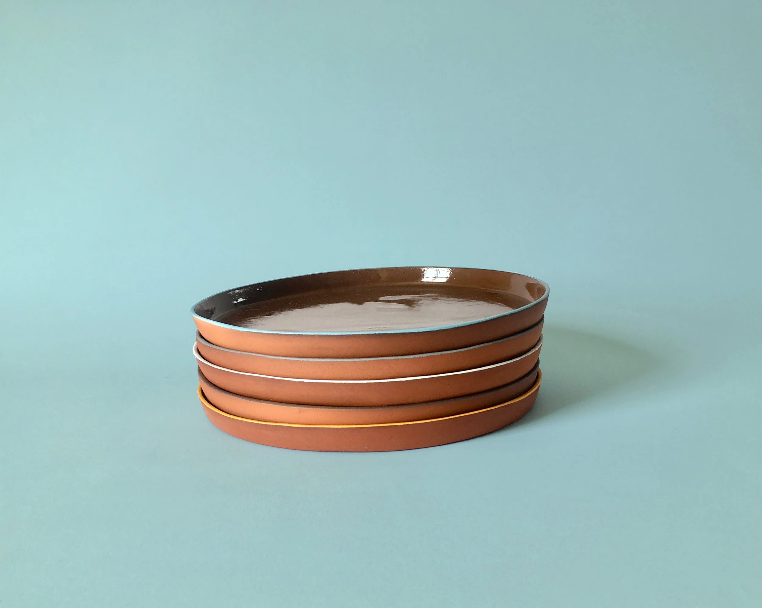 DennisBlatchleyCeramics_stackofvariedcoloureddinnerplates_slipcastterracottaceramic_2025_2cmhx26cmd_£40each.jpeg