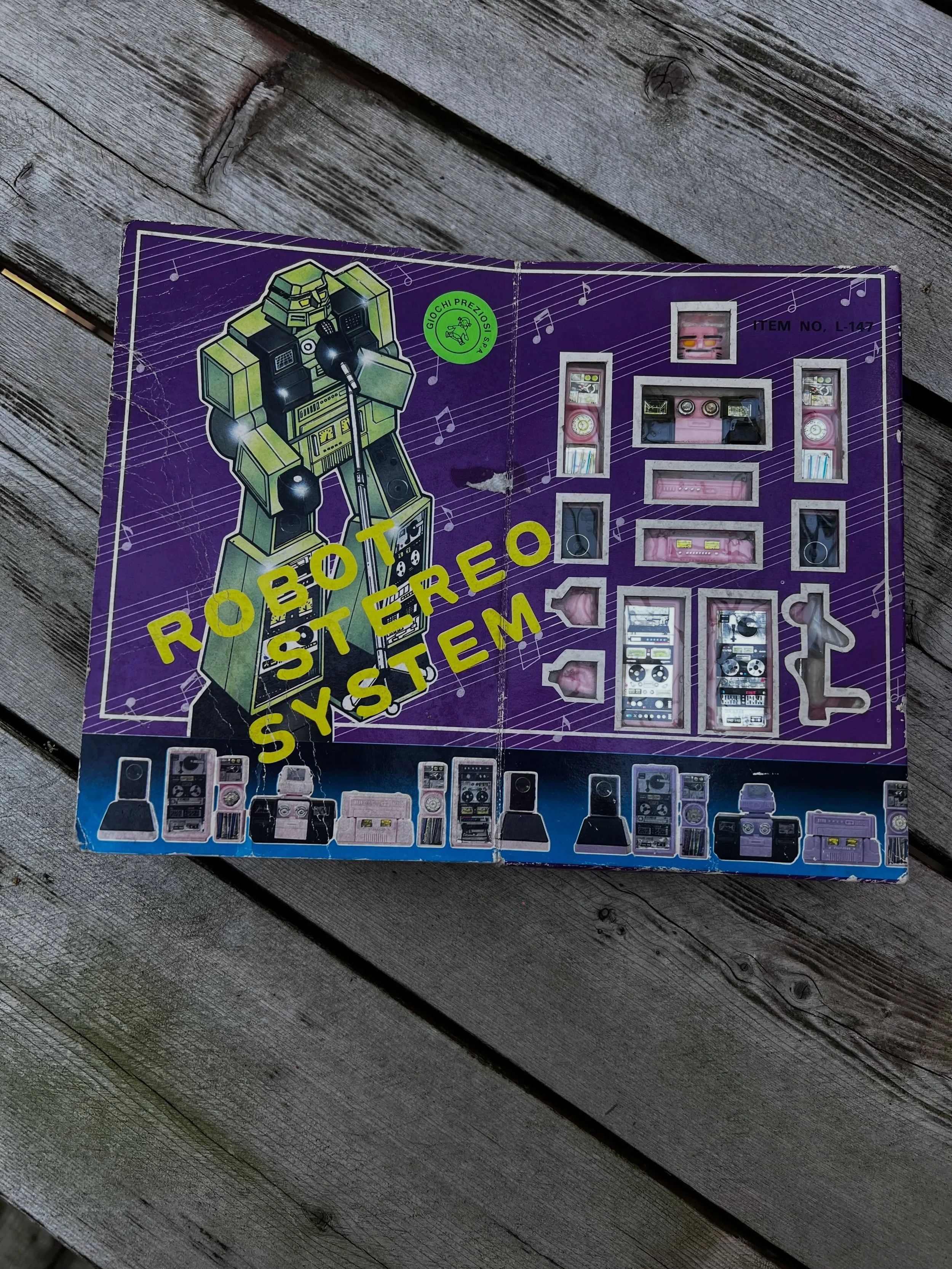 FOR SALE $100 CAD +SHIPPING // I have more than one of these available. Vintage transforming robot toy set is made of pink and black plastic. This set includes multiple components that resemble stereo equipment, such as speakers, a turntable, and a c