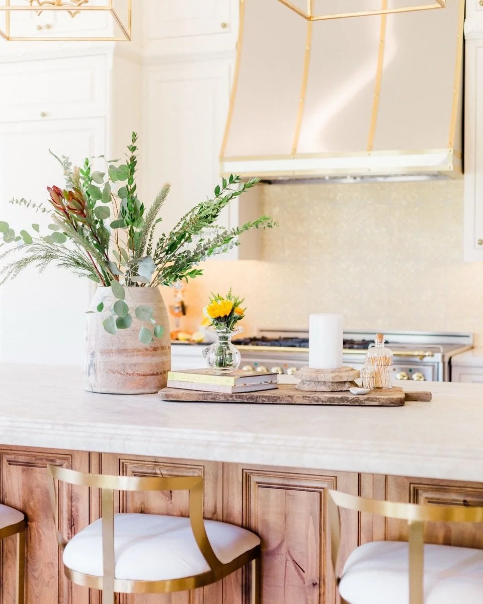 ✨ Throwback Thursday to this French Country beauty ✨

This kitchen was designed to feel collected, warm, and timeless &mdash; never trendy.

We paired creamy custom cabinetry with a richly stained wood island to bring depth and contrast, then layered