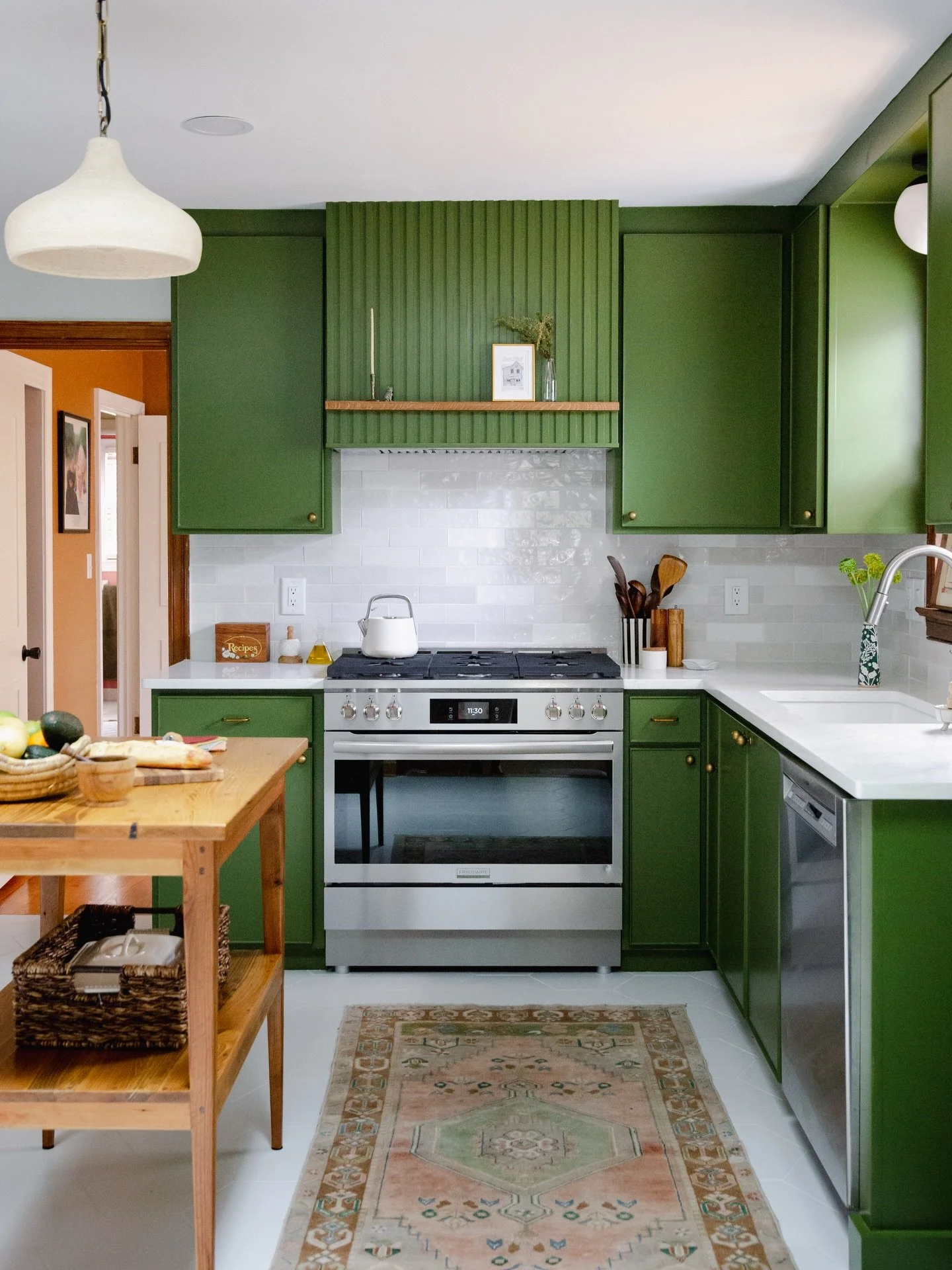 Transform Tuesday ✨

From honey-oak and heavy to rich, moody, and timeless.
This mid-century 1950s kitchen was completely reimagined with custom cabinetry and a custom island by Landrum, brought to life by the incredible craftsmanship of Krug Constru