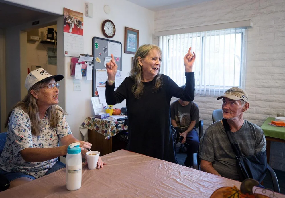  Peggy Graves, middle, is the birthday girl and takes in all the attention as residents at Miracle Square, 2601 N Oracle Rd., gather in the front office for cake and celebration on September 26, 2019. Miracle Square helps adults with disabilities and