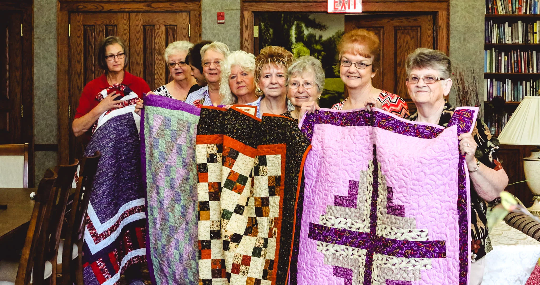 Group holding quilts.jpg