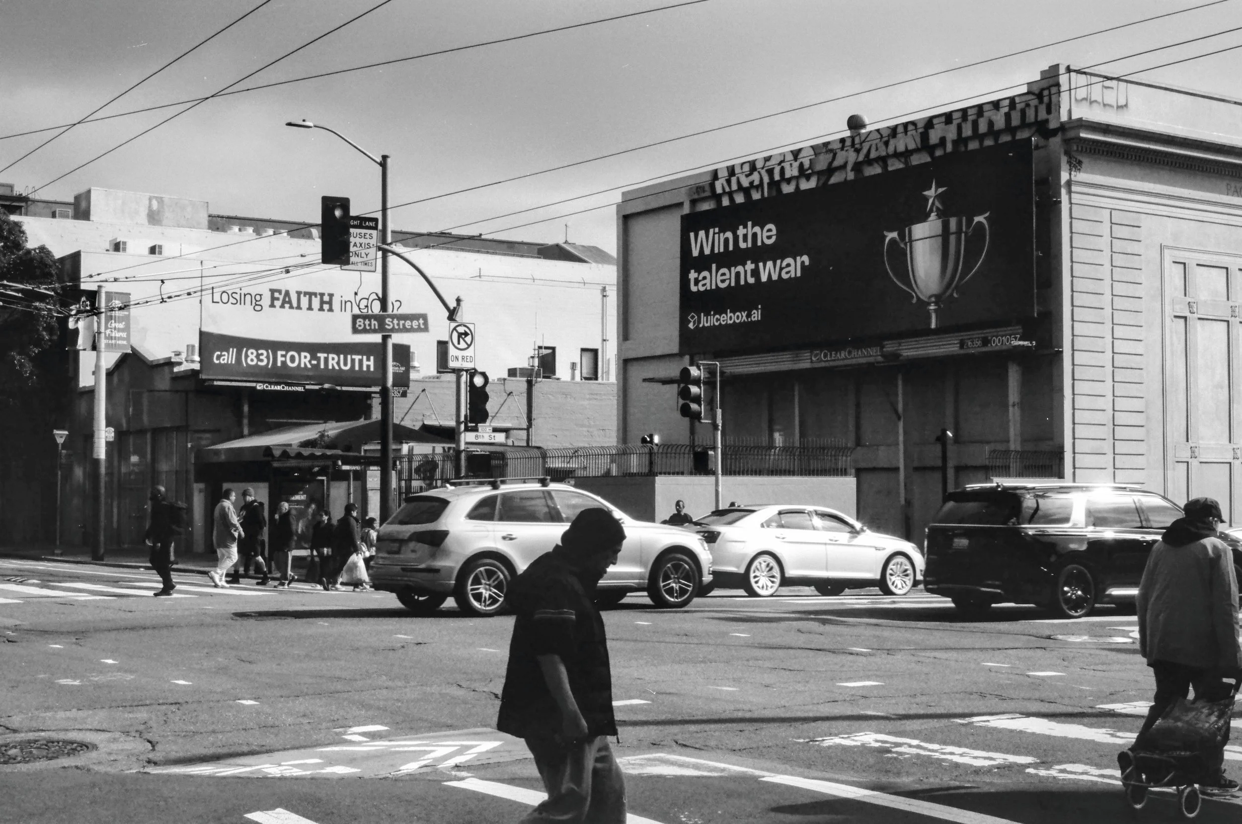 A billboard for an AI company right next to one about losing faith in god. Oh, the irony. Just as ironic: a billboard for recruiting technology in a neighborhood where homeless/jobless people live. Shot at Mission and 8th St in SoMa, using Kodak T-MA
