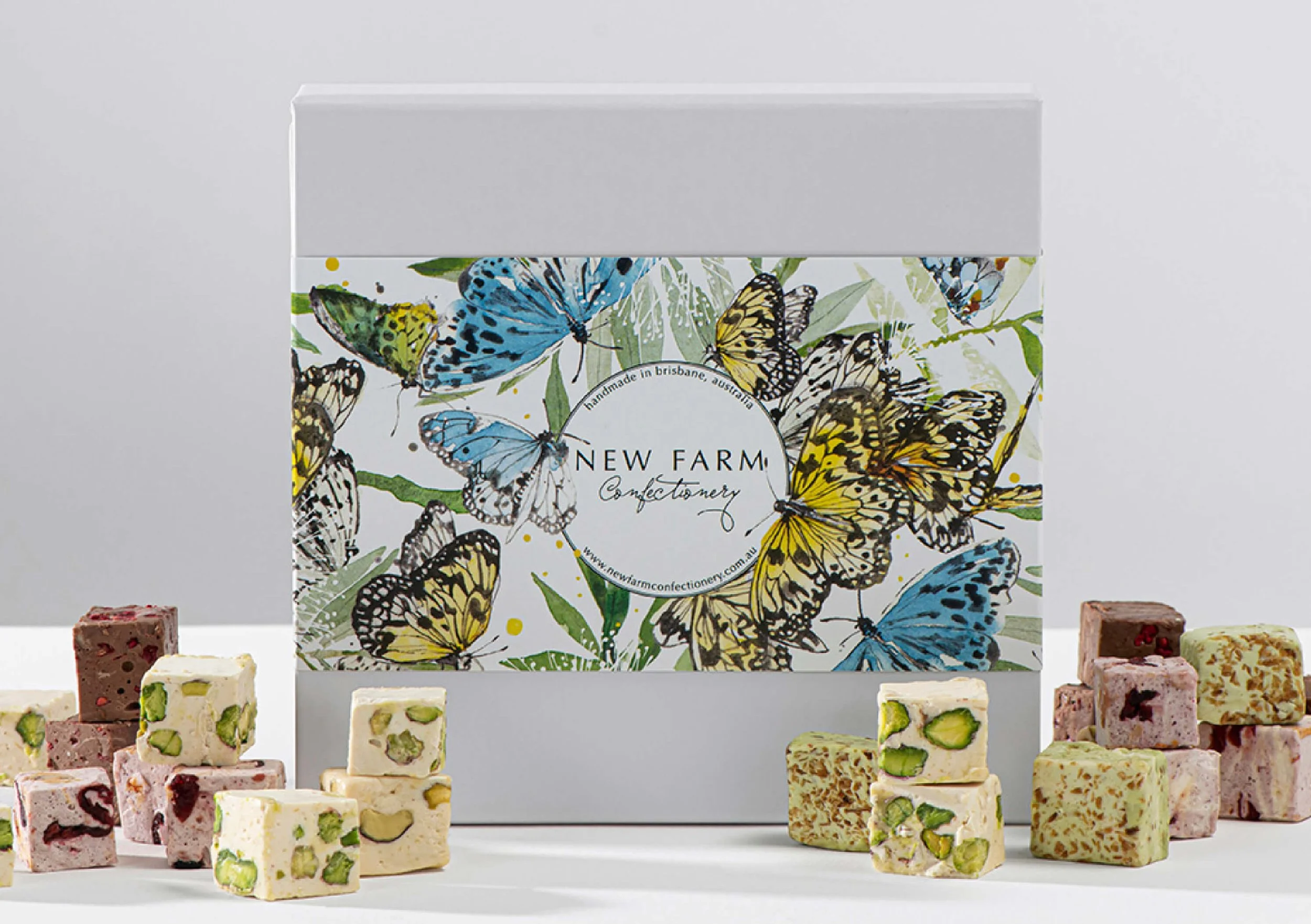 Hand-painted watercolour butterfly packaging illustration created for New Farm Confectionery Mother’s Day seasonal gift box campaign.