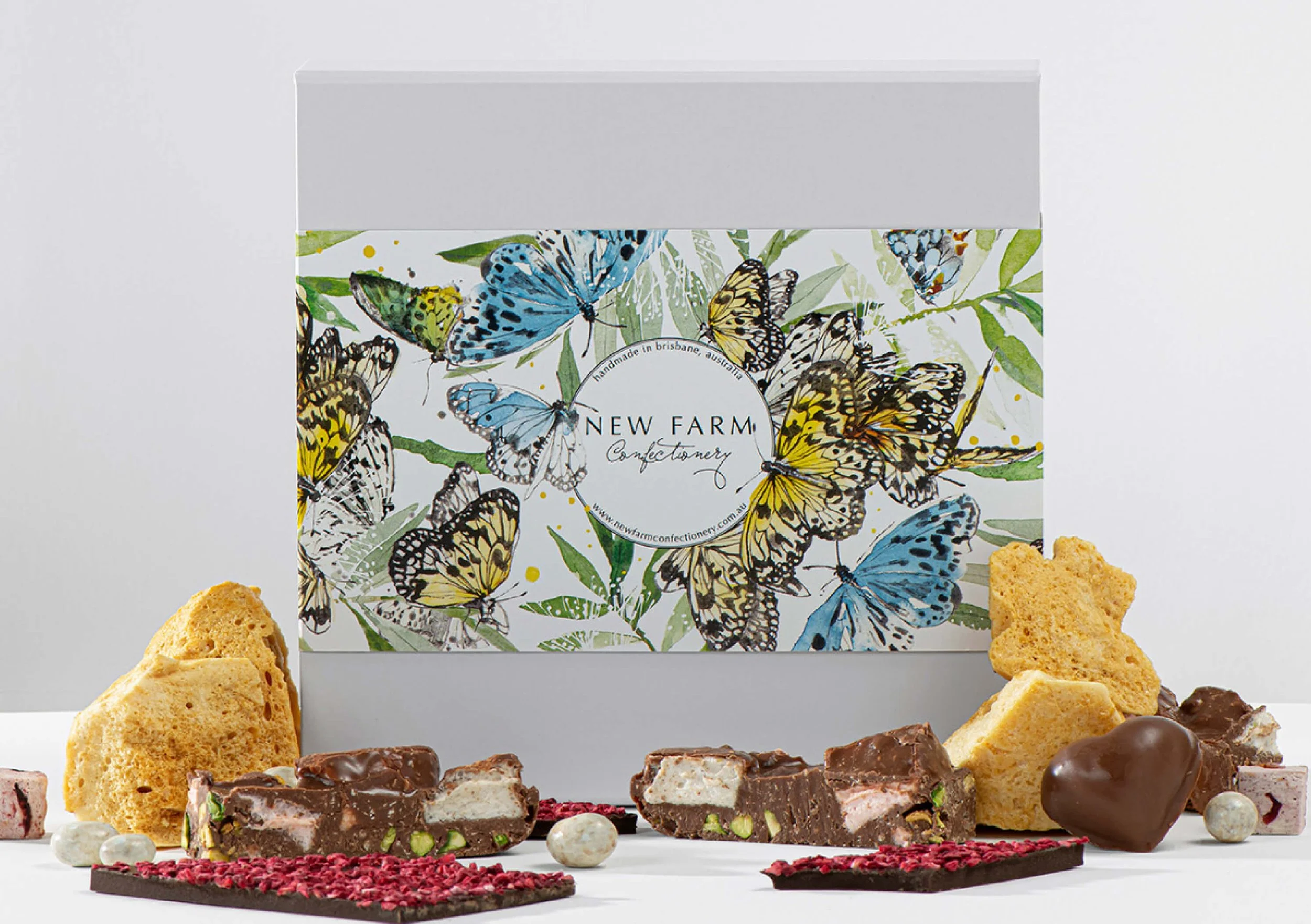 Hand-painted watercolour butterfly packaging illustration created for New Farm Confectionery Mother’s Day seasonal gift box campaign.