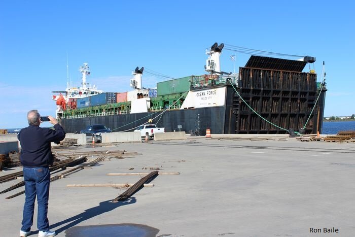 Paulsboro Tour-Vince J. photographs small ship at new pier-Baile_L.JPG