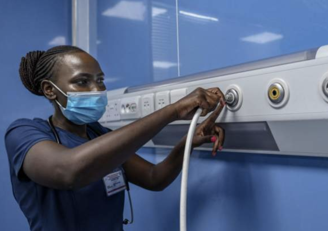 UK and Kenya say nurse recruitment plan is still on Critical care nurse, Emily Chepng'eno plugs a ventilator machine hose into the Oxygen delivery port