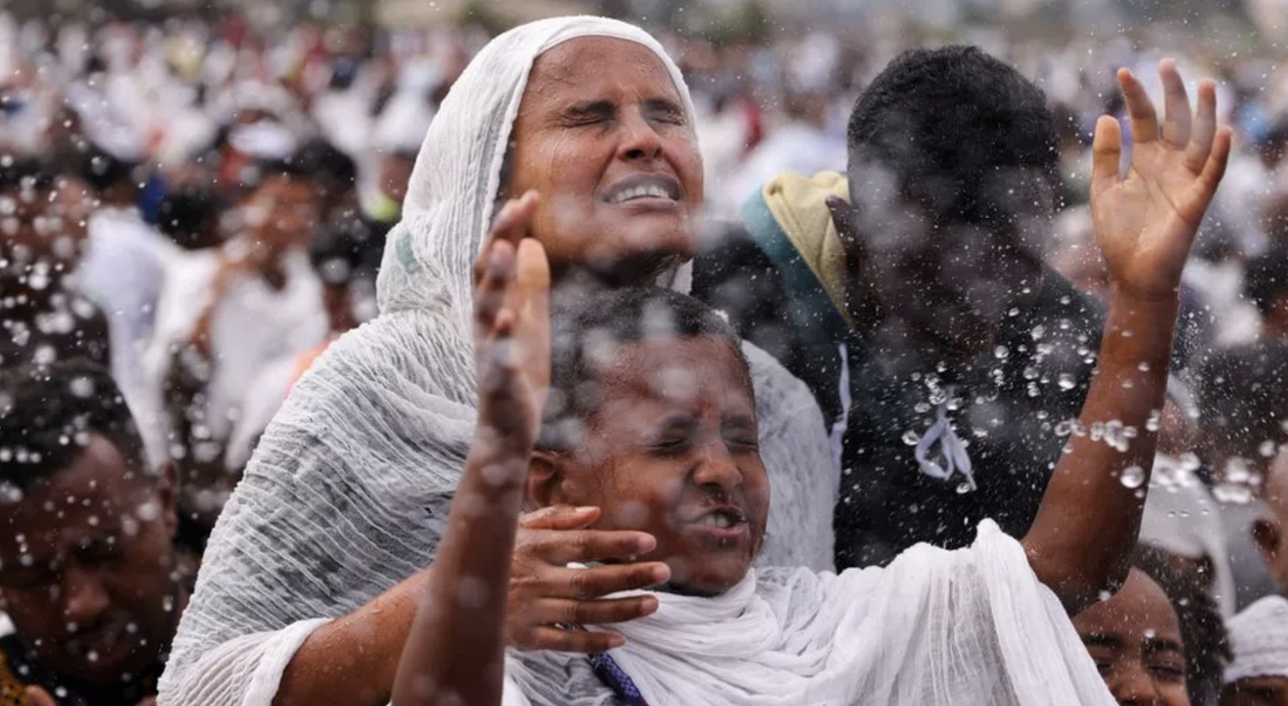 Timket: Ethiopians leap into pool during holy festival