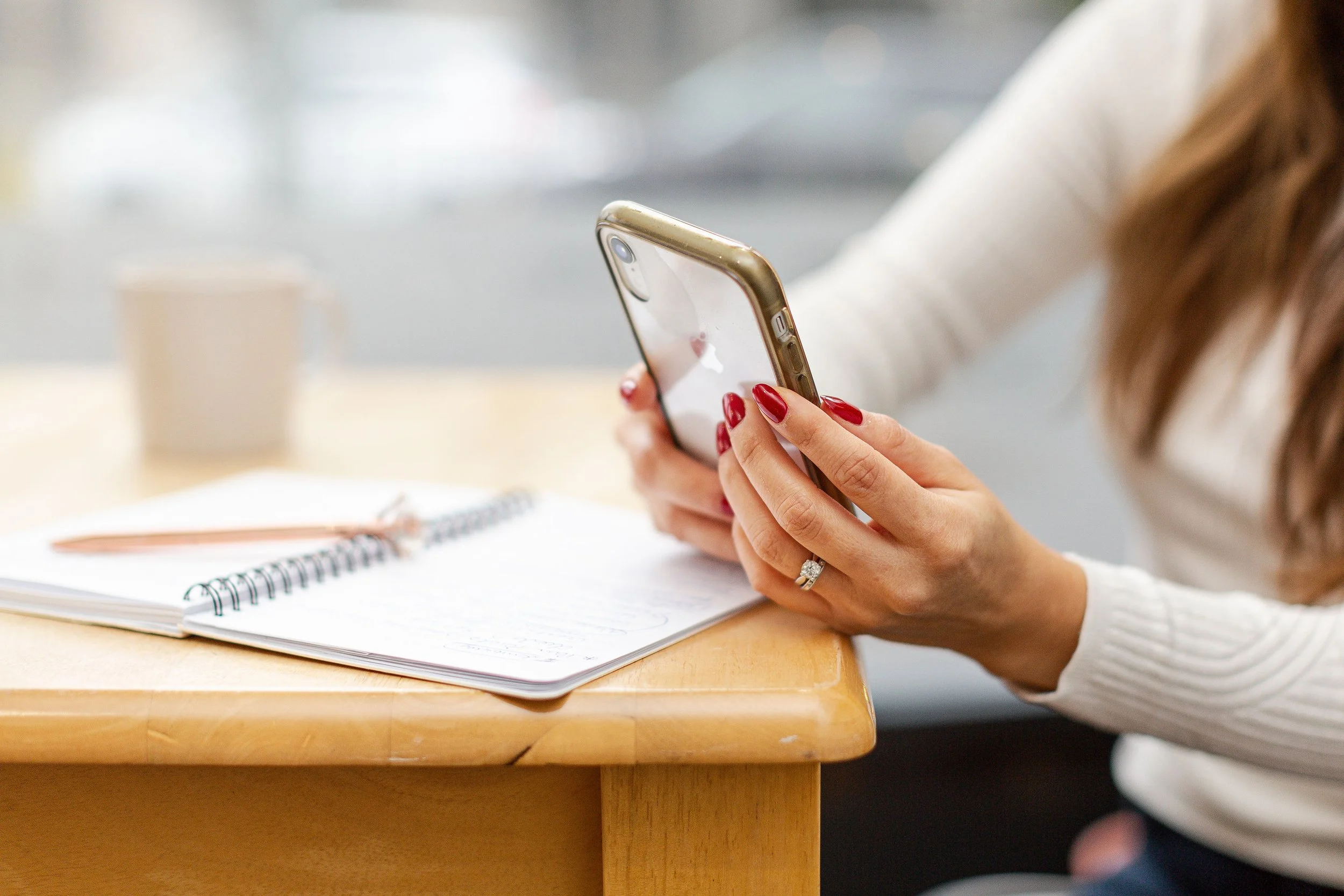 Lucia on her mobile phone at her desk