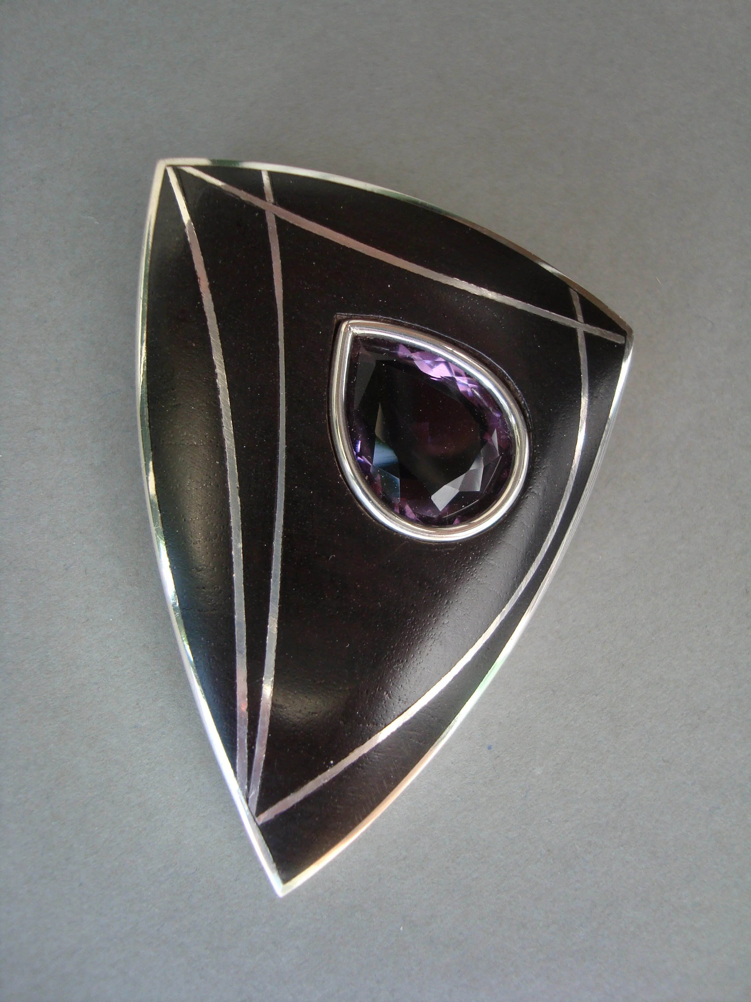 Silver & ebony brooch with amethyst