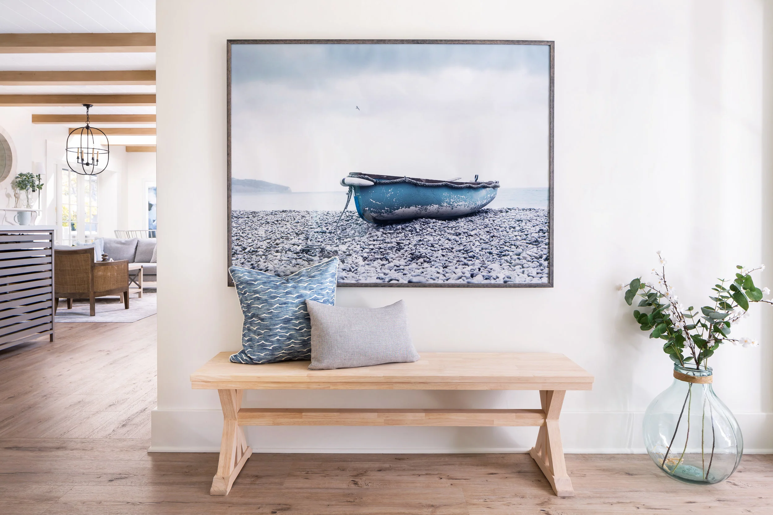 Interior Hideaway with bench, pillows, and a hanging picture of a boat