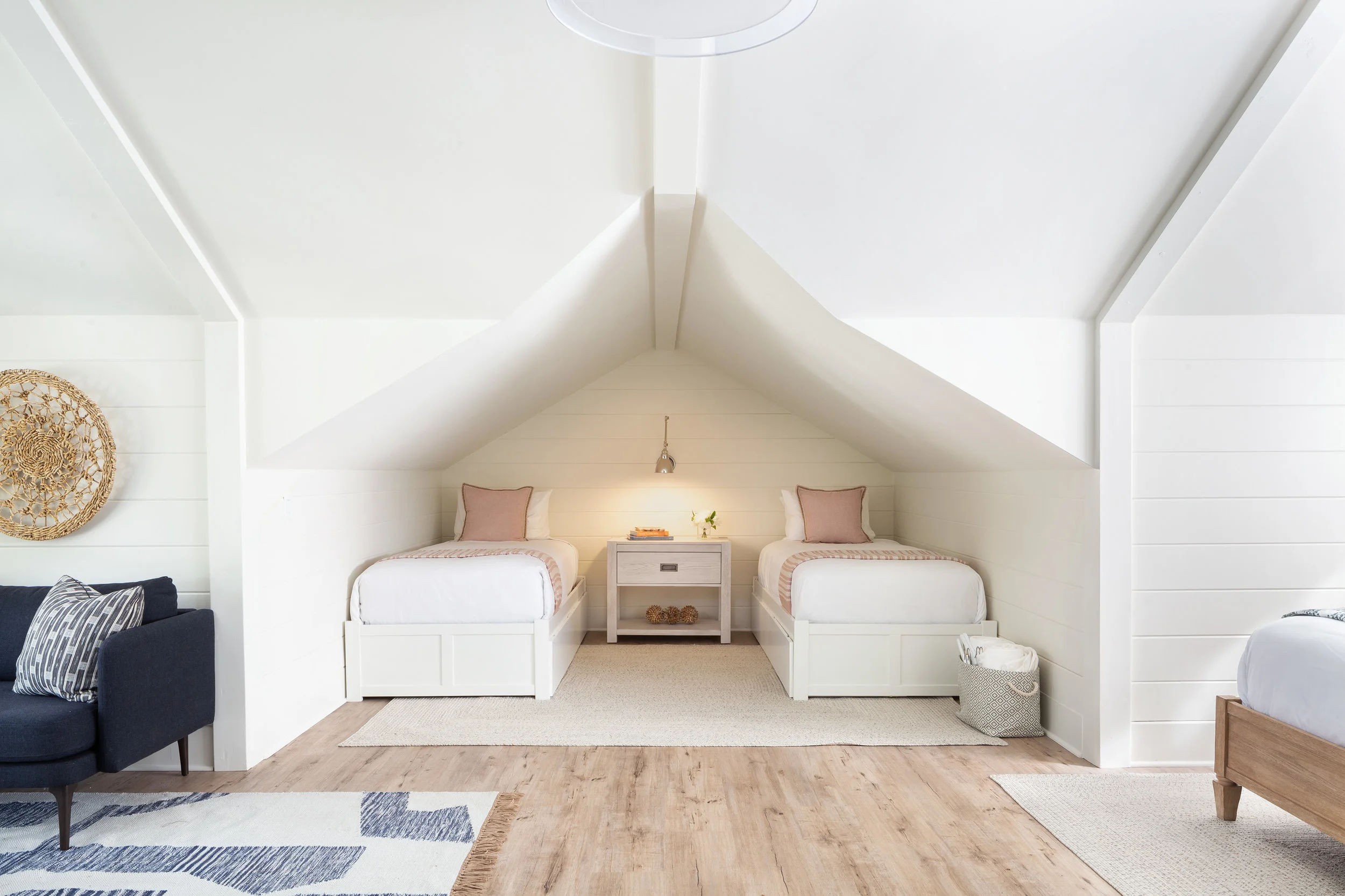 two twin beds with nightstand in between