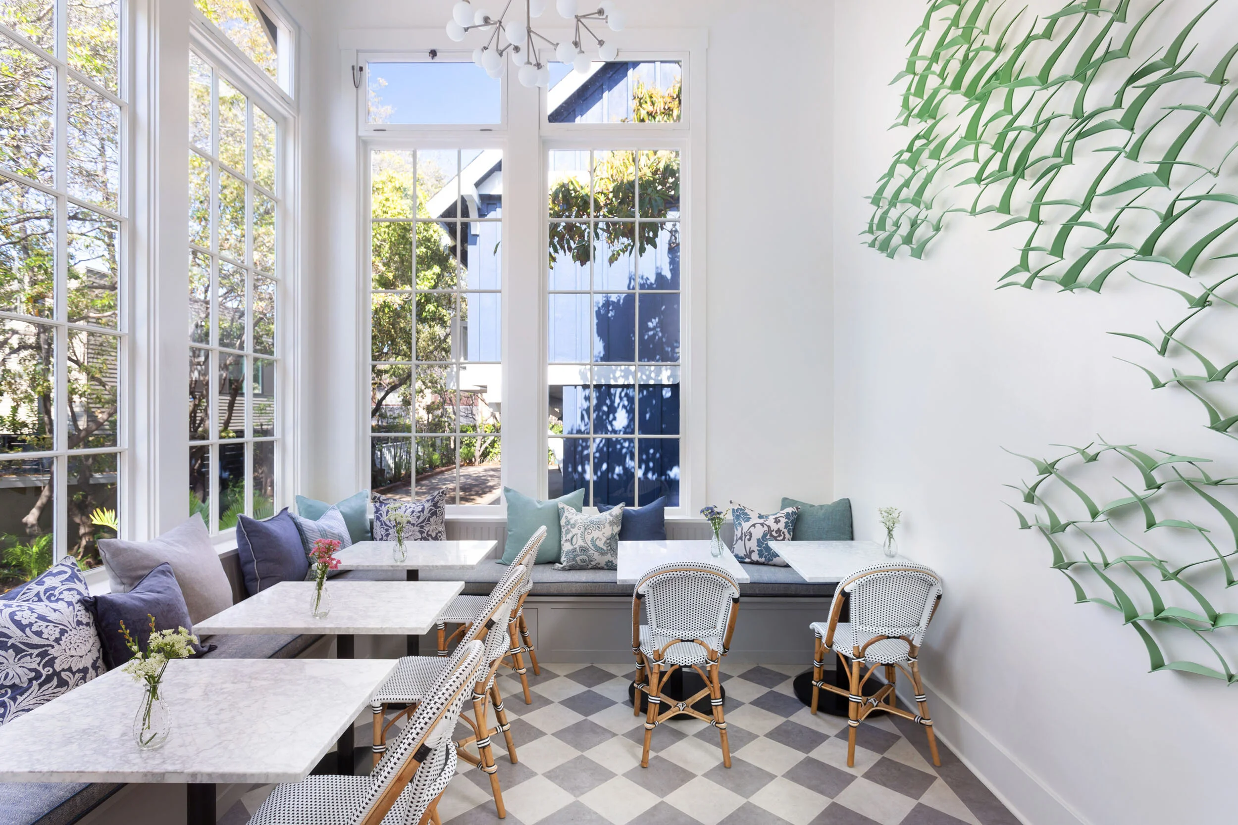 Interior living space with empty tables and large windows