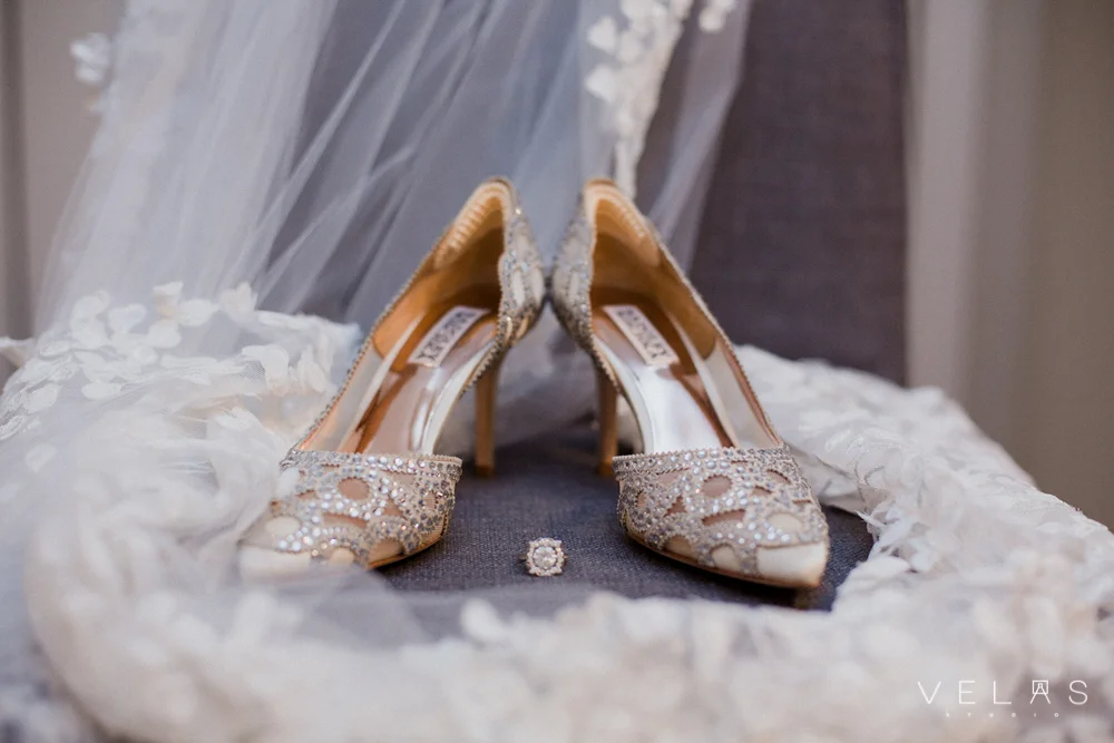 Bridal shoes, veil, and engagement ring.