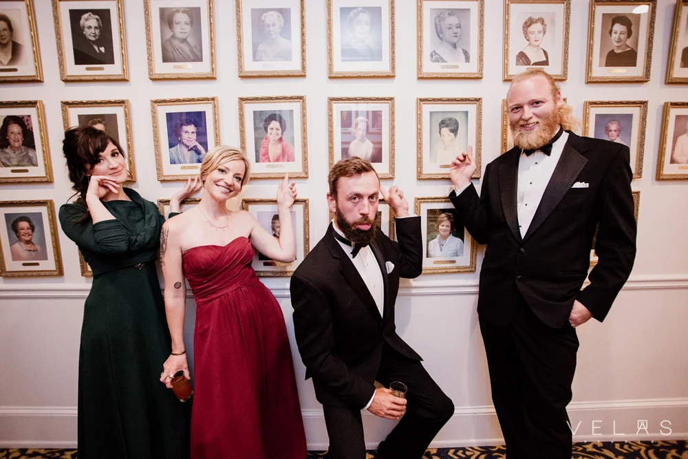 Wedding guests at The Wimbish House strike a pose with the former presidents of the Atlanta Woman’s Club.
