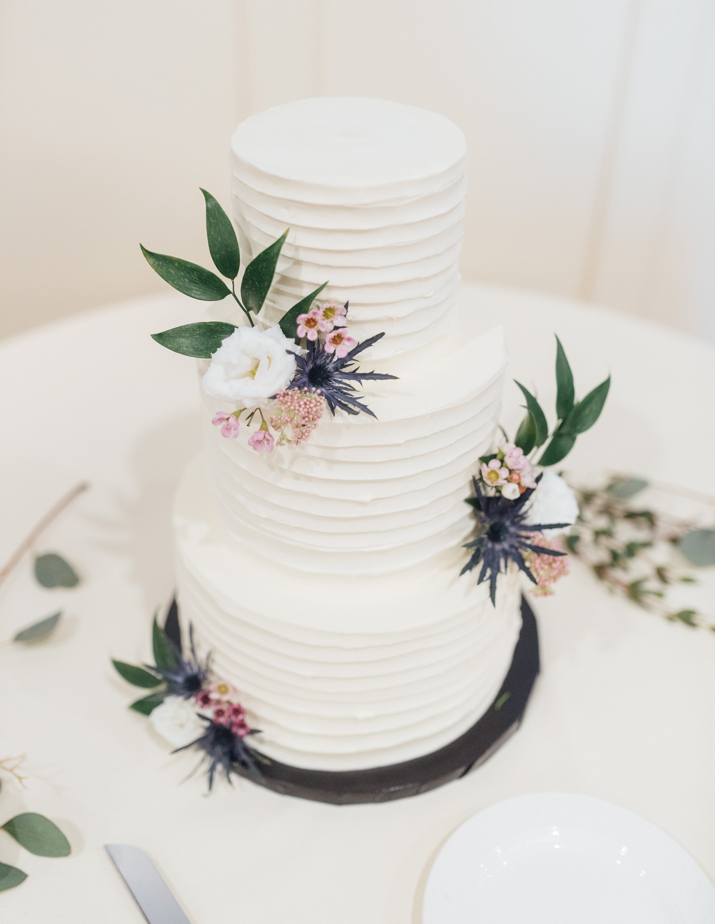 soft ruffle wedding cake - floral accent