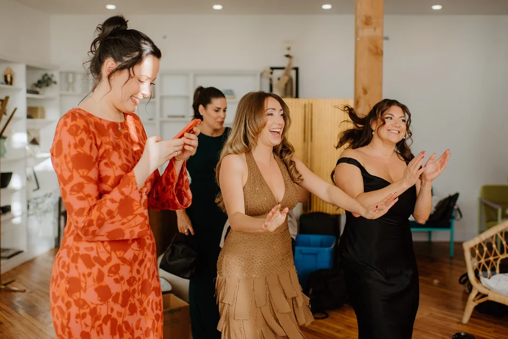 STORYS Building Wedding in Toronto Robyn and Tyler – Bridesmaids reacting to the champagne pop