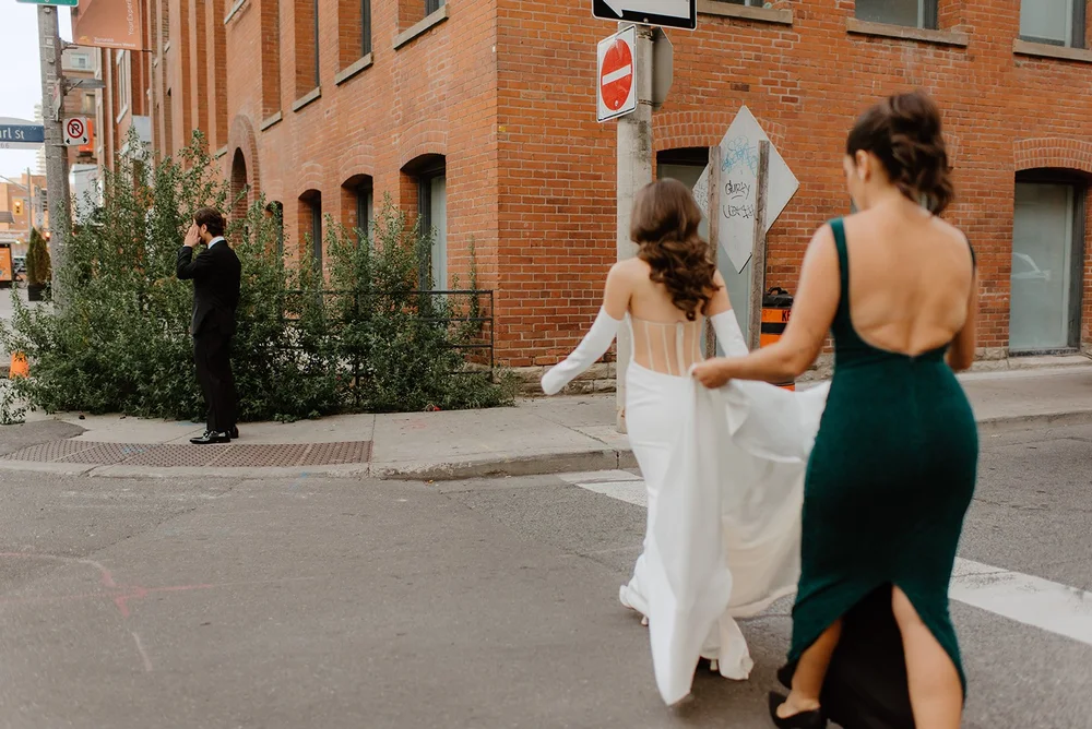 STORYS Building Wedding in Toronto Robyn and Tyler – Bride walking down the street in her wedding dress