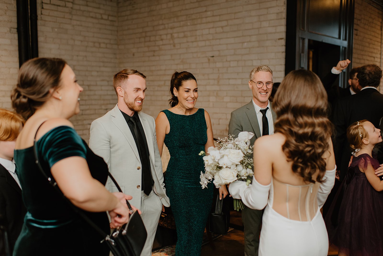 STORYS Building Wedding in Toronto Robyn and Tyler – Bride Chatting with Wedding Guests