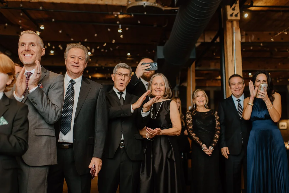 STORYS Building Wedding in Toronto Robyn and Tyler – Wedding guest celebrating as the couple signed their marriage license