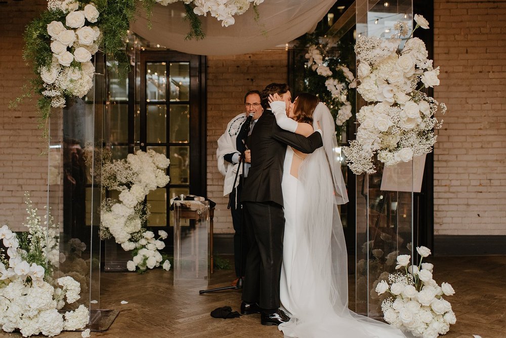 STORYS Building Wedding in Toronto Robyn and Tyler – Kissing as newlyweds