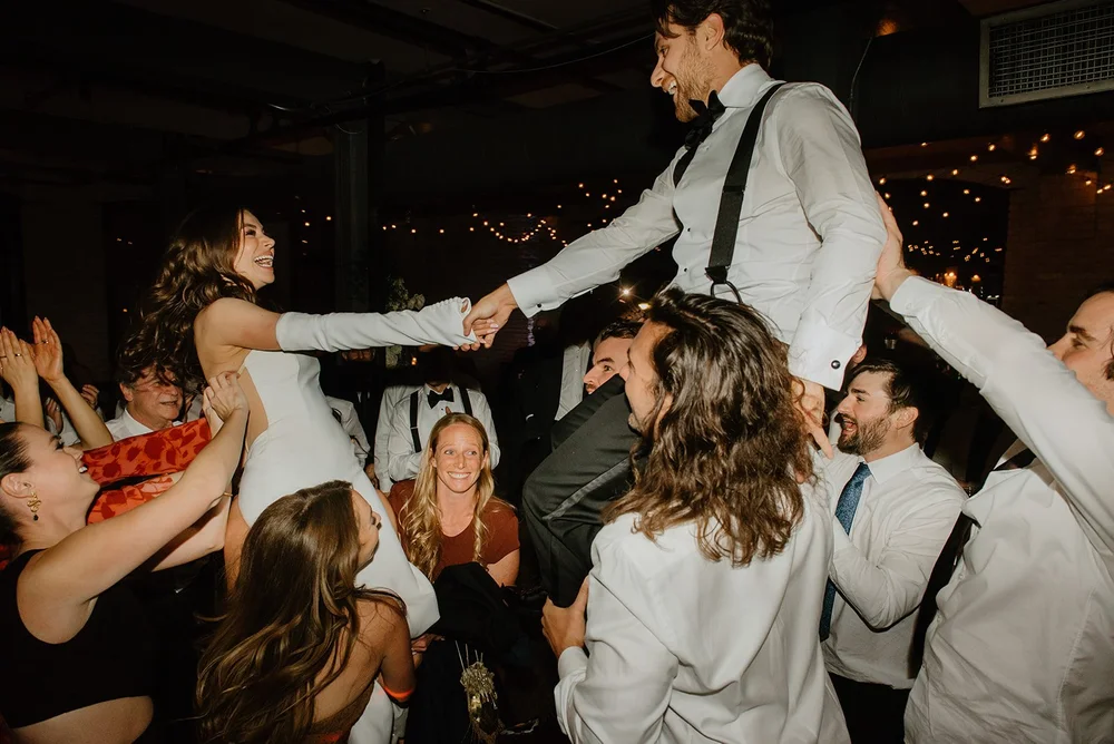 STORYS Building Wedding in Toronto Robyn and Tyler – Bride and groom enjoying the Hora dance, surrounded by celebration and joy