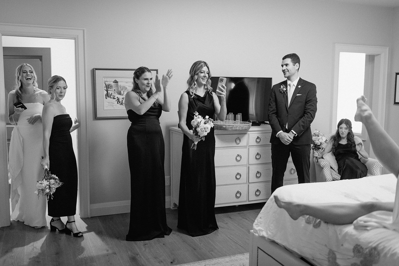Family Home Kingston Wedding of Vanessa and Liz – candid moments of bride and wedding guests inside the preparation venue, sharing laughter and excitement
