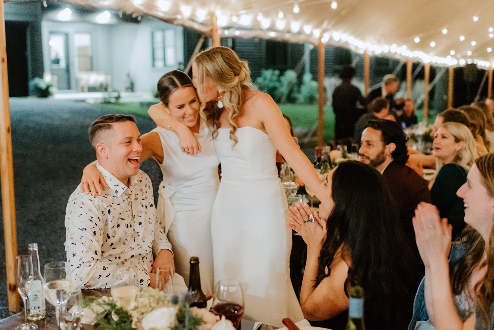 Family Home Kingston Wedding of Vanessa and Liz – emotional hug between bride and guest during candid reception moment