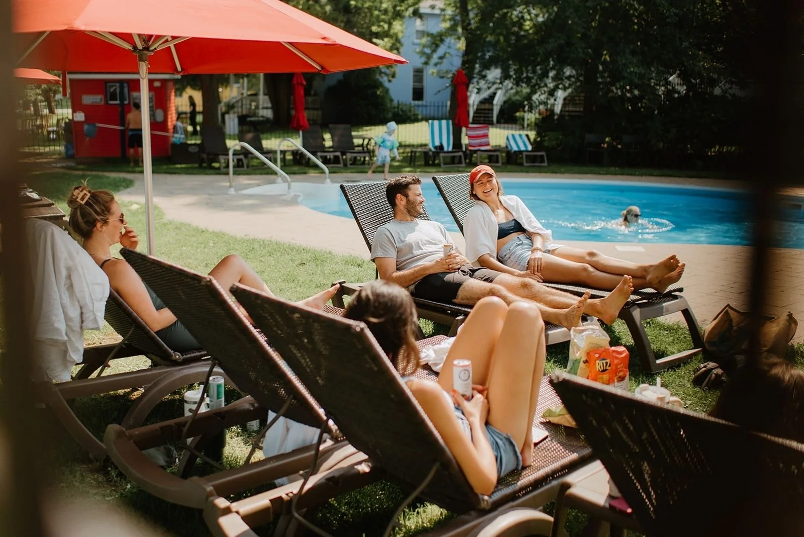 Joyful Bayview Wildwood Wedding – Wedding guests relax by the pool at Bayview Wildwood.
