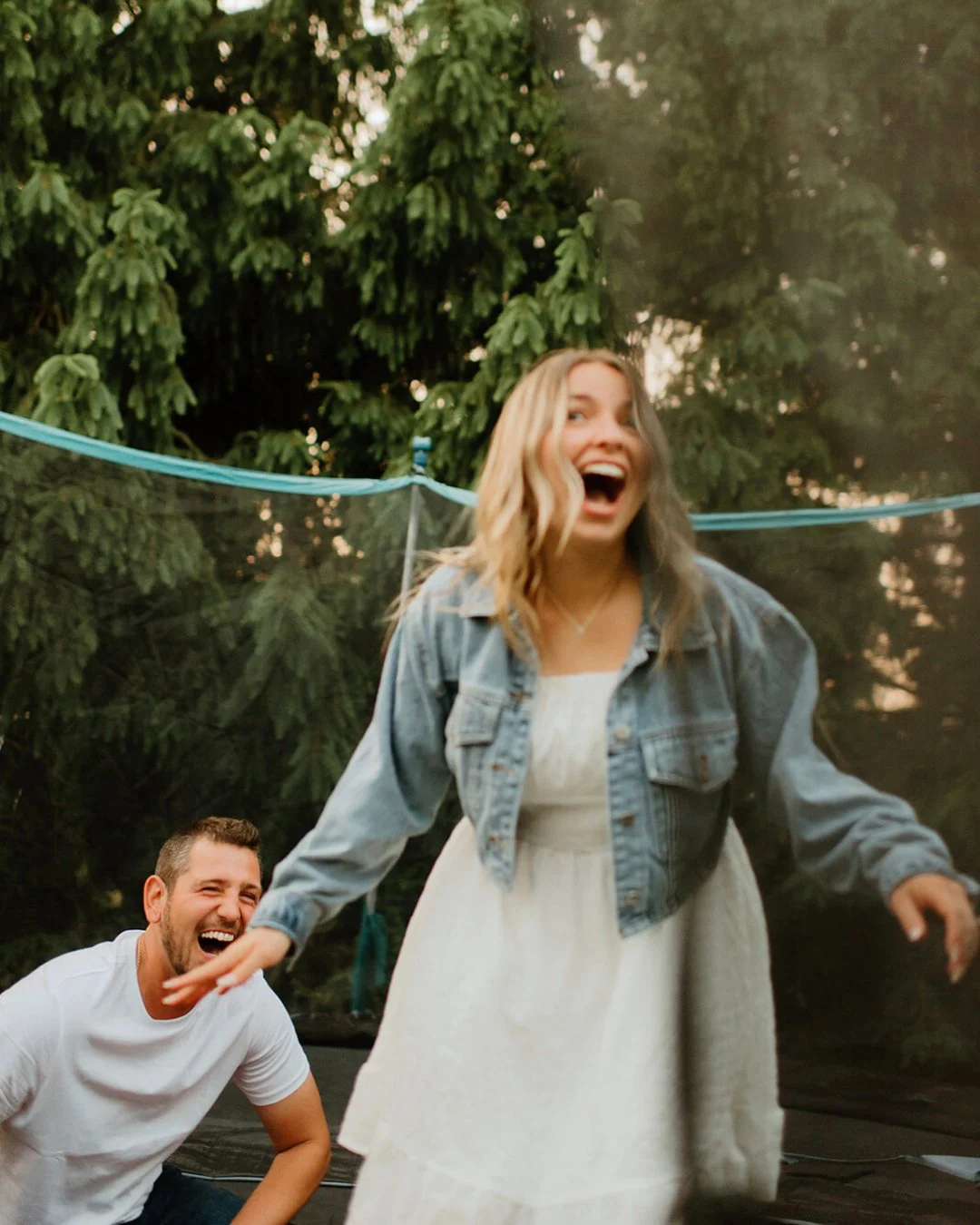 The session was technically over as we were saying our goodbyes and and then out of the corner of my eye I saw this trampoline hidden away behind the house on their family's farm. Then I said, WAIT NEVERMIND! Can you two bounce around on it!?

Knowin