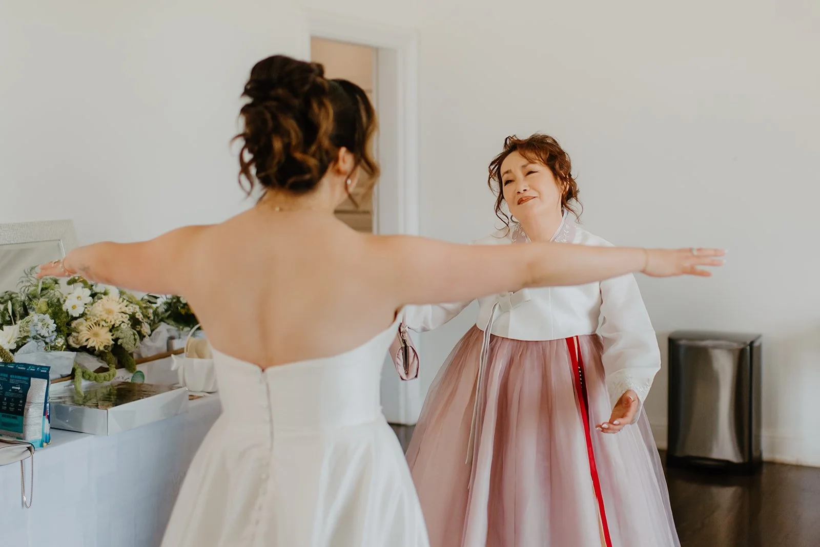 Eaton Hall Wedding in King City | Benita + Allen – Emotional first look between Benita and her mother in the bridal suite.