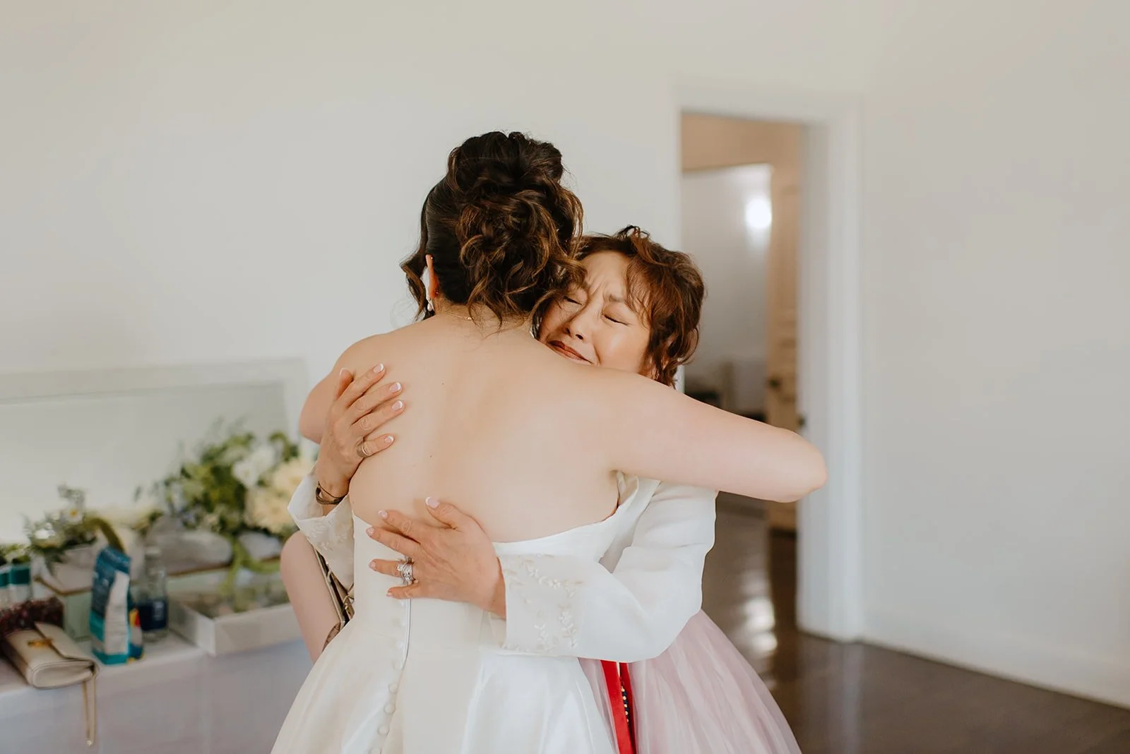 Eaton Hall Wedding in King City | Benita + Allen – Emotional first look between Benita and her mother in the bridal suite.
