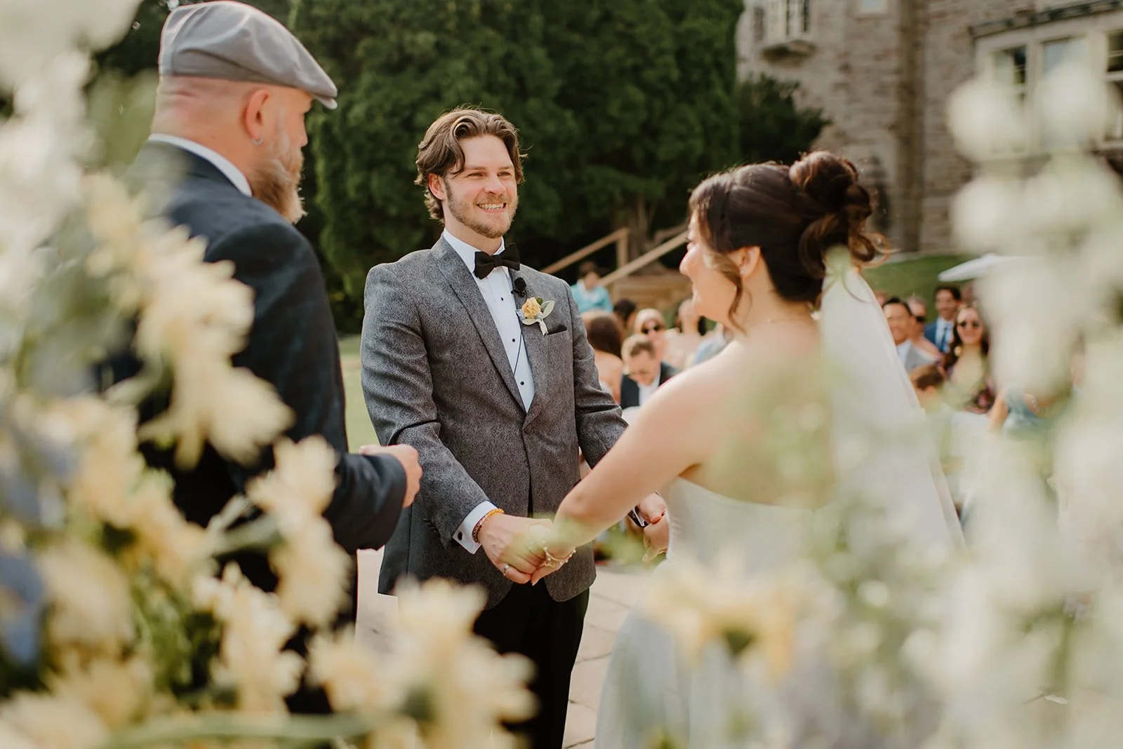 Eaton Hall Wedding in King City | Benita + Allen – Candid shot of Benita and Allen looking at each other during the ceremony.