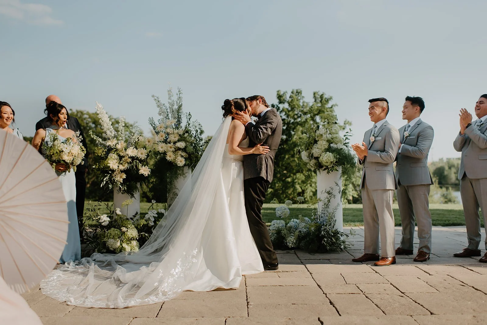 Eaton Hall Wedding in King City | Benita + Allen – The first kiss at the altar with Eaton Hall in the background.