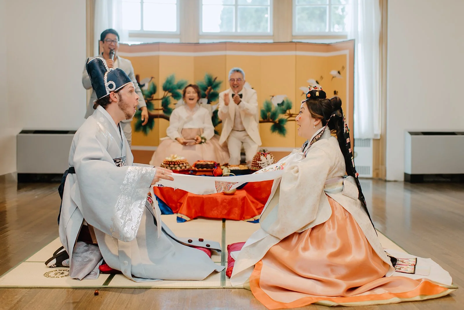 Eaton Hall Wedding in King City | Benita + Allen – Joyful expressions during the traditional chestnut and date tossing ritual.
