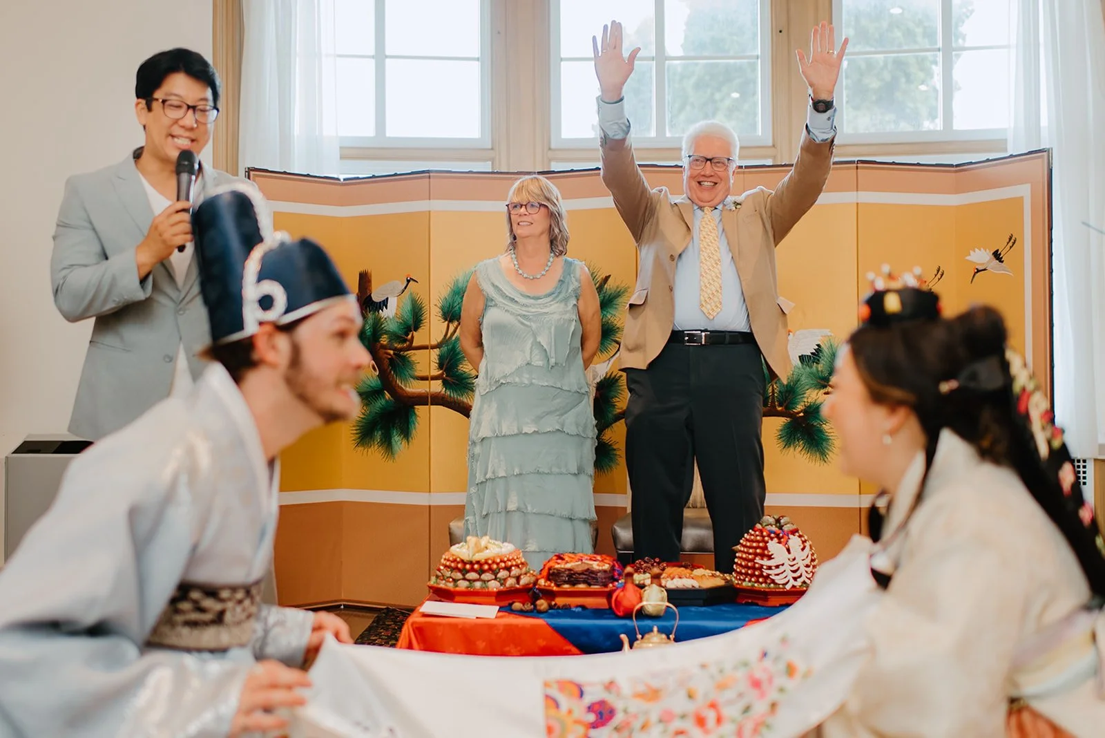Eaton Hall Wedding in King City | Benita + Allen – Joyful expressions during the traditional chestnut and date tossing ritual.