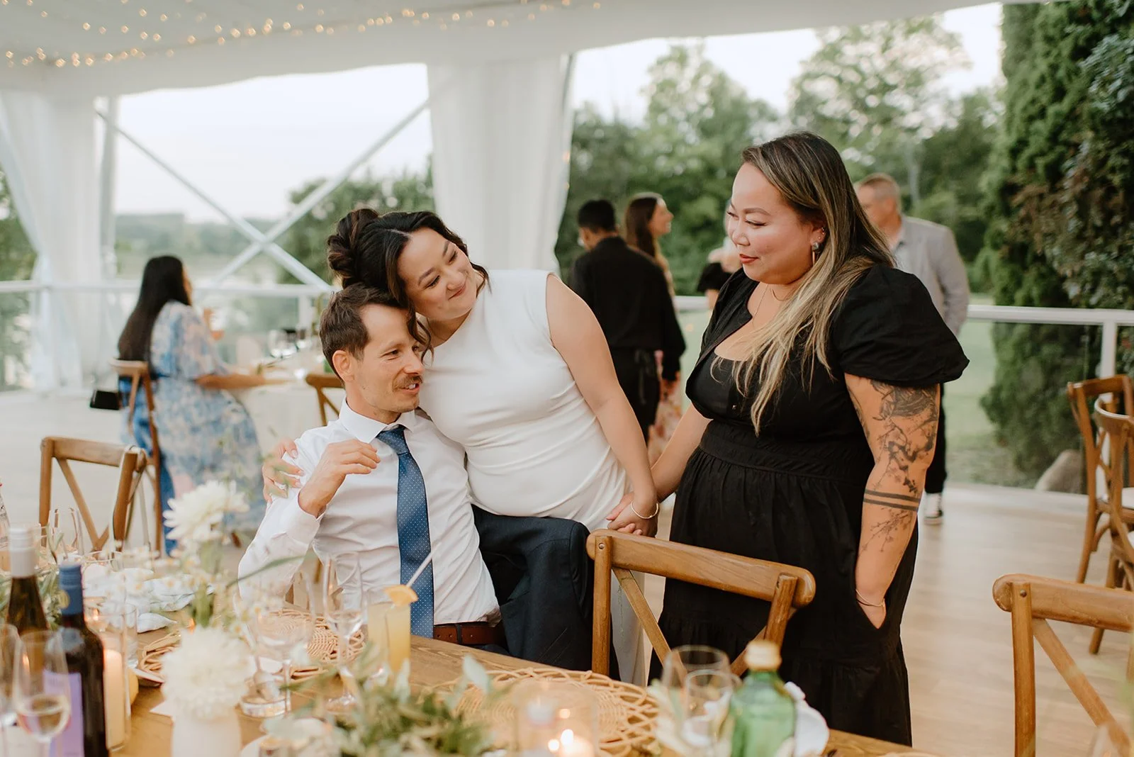 Eaton Hall Wedding in King City | Benita + Allen – Guests laughing and drinking during the vibrant reception.