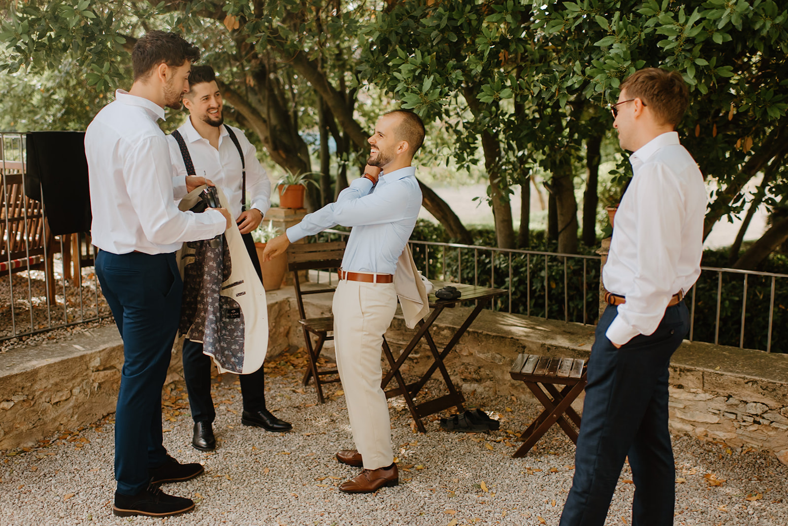 Castell de Barxell Wedding | A Romantic Spanish Countryside Celebration with Zuzanna + Raul – Raul laughing with his groomsmen during the morning preparations.