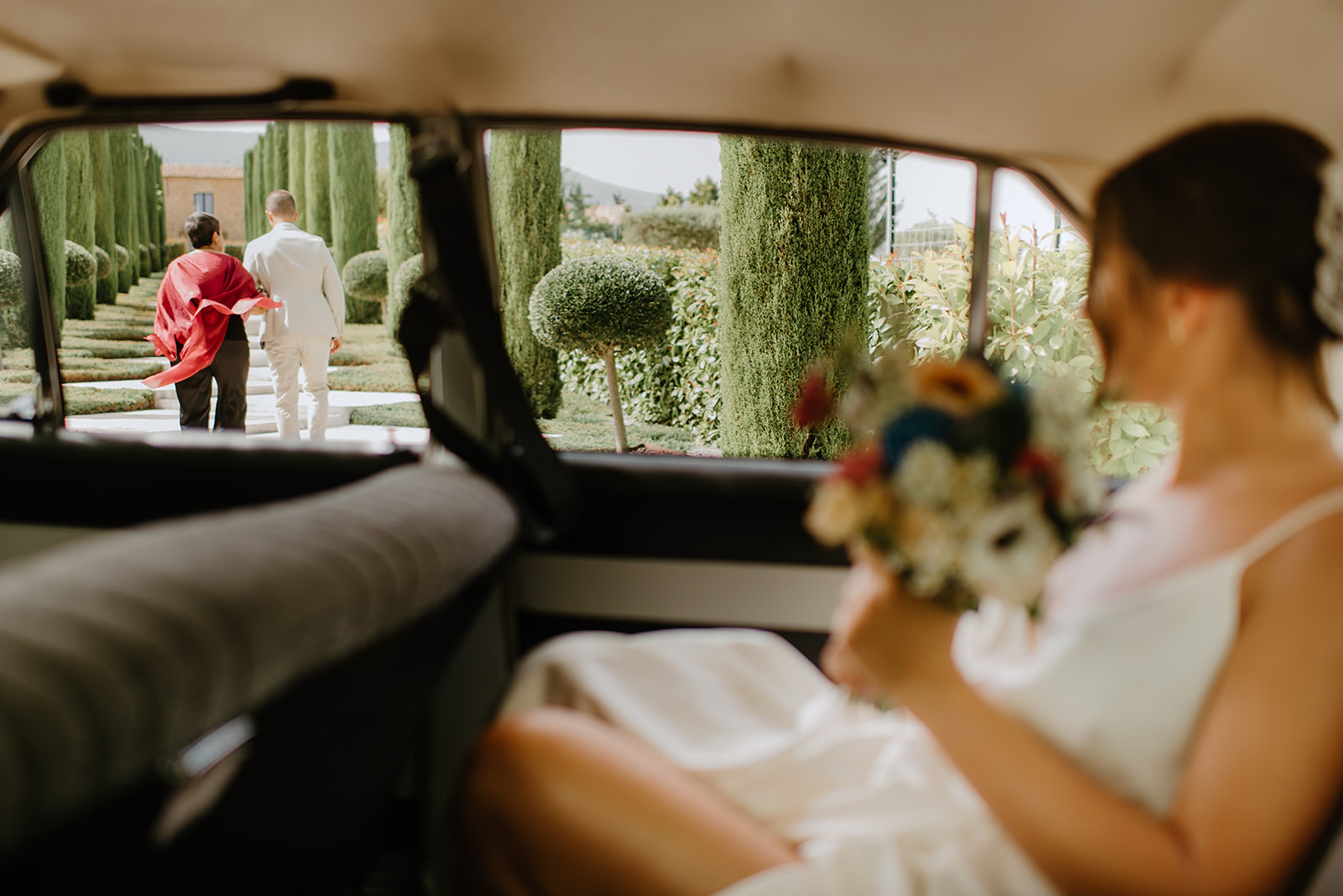 Castell de Barxell Wedding | A Romantic Spanish Countryside Celebration with Zuzanna + Raul – The stone pathway leading to the ceremony site lined with trees.