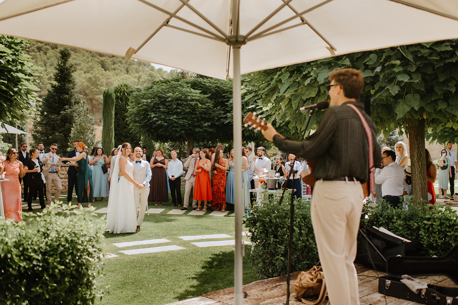 Castell de Barxell Wedding | A Romantic Spanish Countryside Celebration with Zuzanna + Raul – A live Spanish guitarist playing during the cocktail reception.