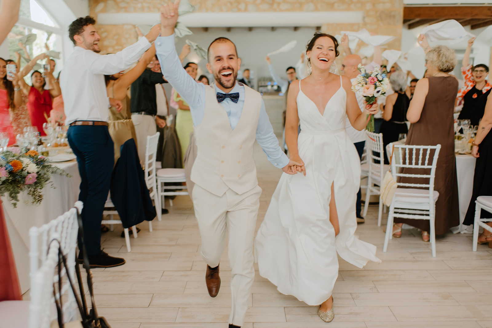 Castell de Barxell Wedding | A Romantic Spanish Countryside Celebration with Zuzanna + Raul – Zuzanna and Raul entering the reception to loud cheers.